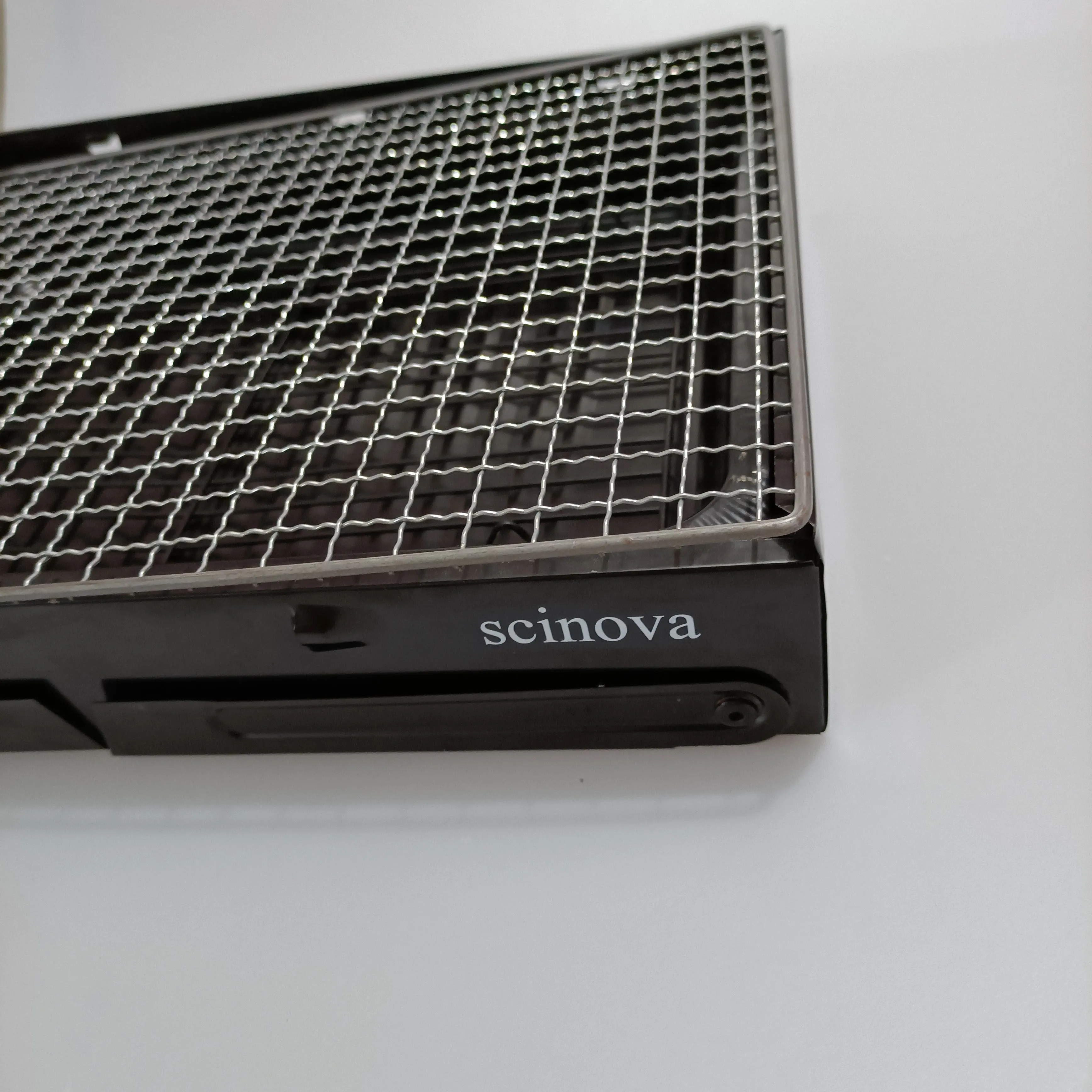 scinova Cooking utensils, namely, grills, foldable leg design, compact and portable
