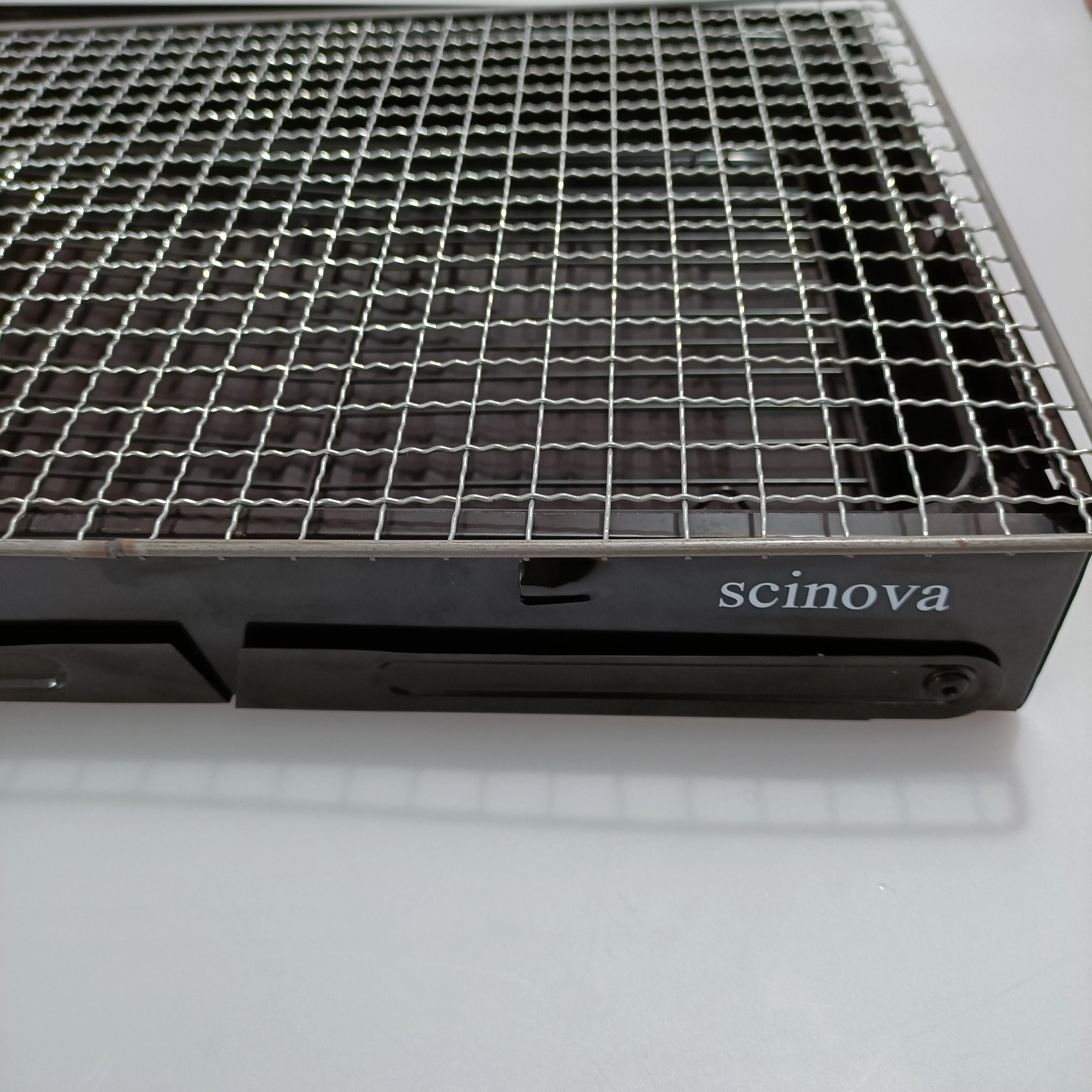 scinova Cooking utensils, namely, grills, foldable leg design, compact and portable