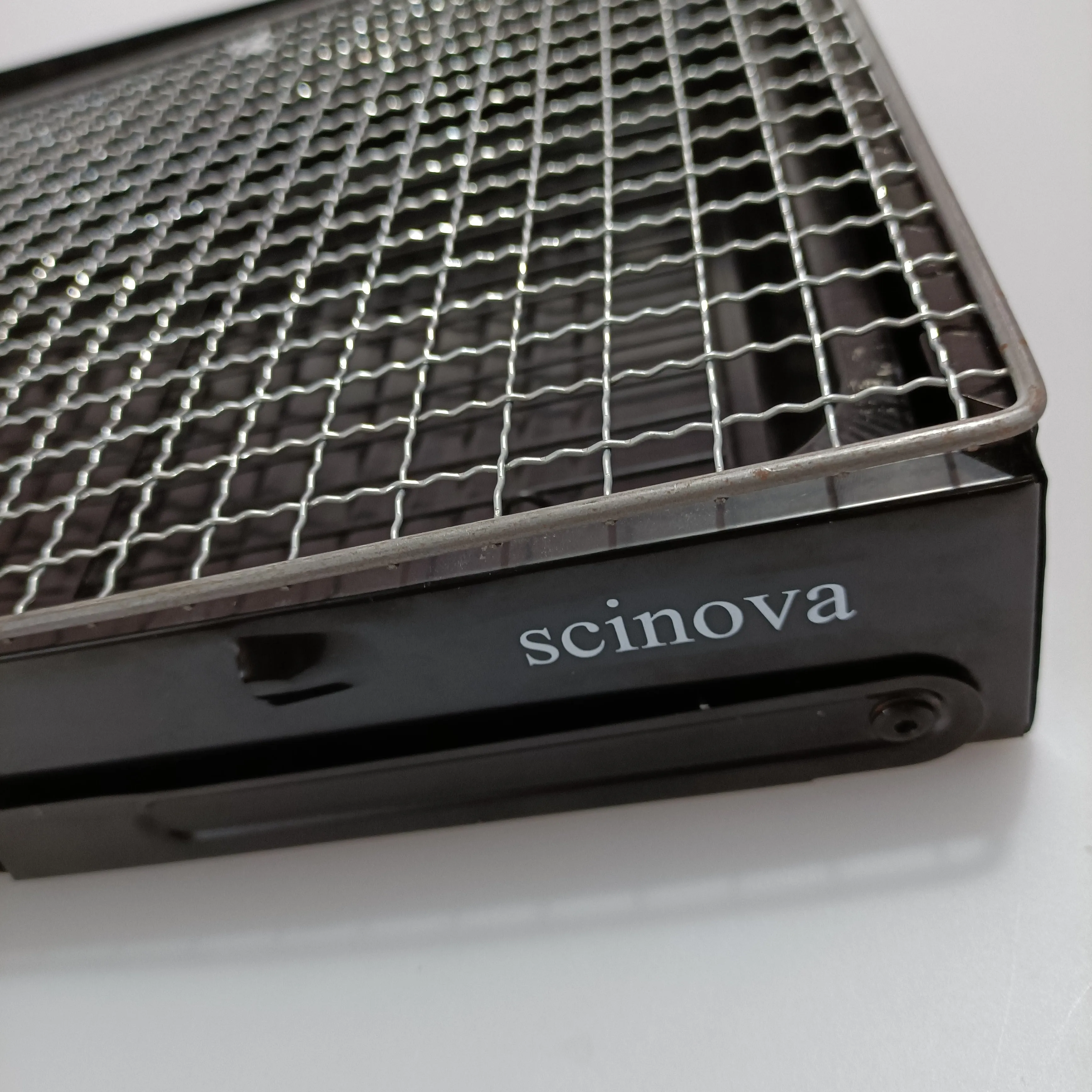 scinova Cooking utensils, namely, grills, foldable leg design, compact and portable