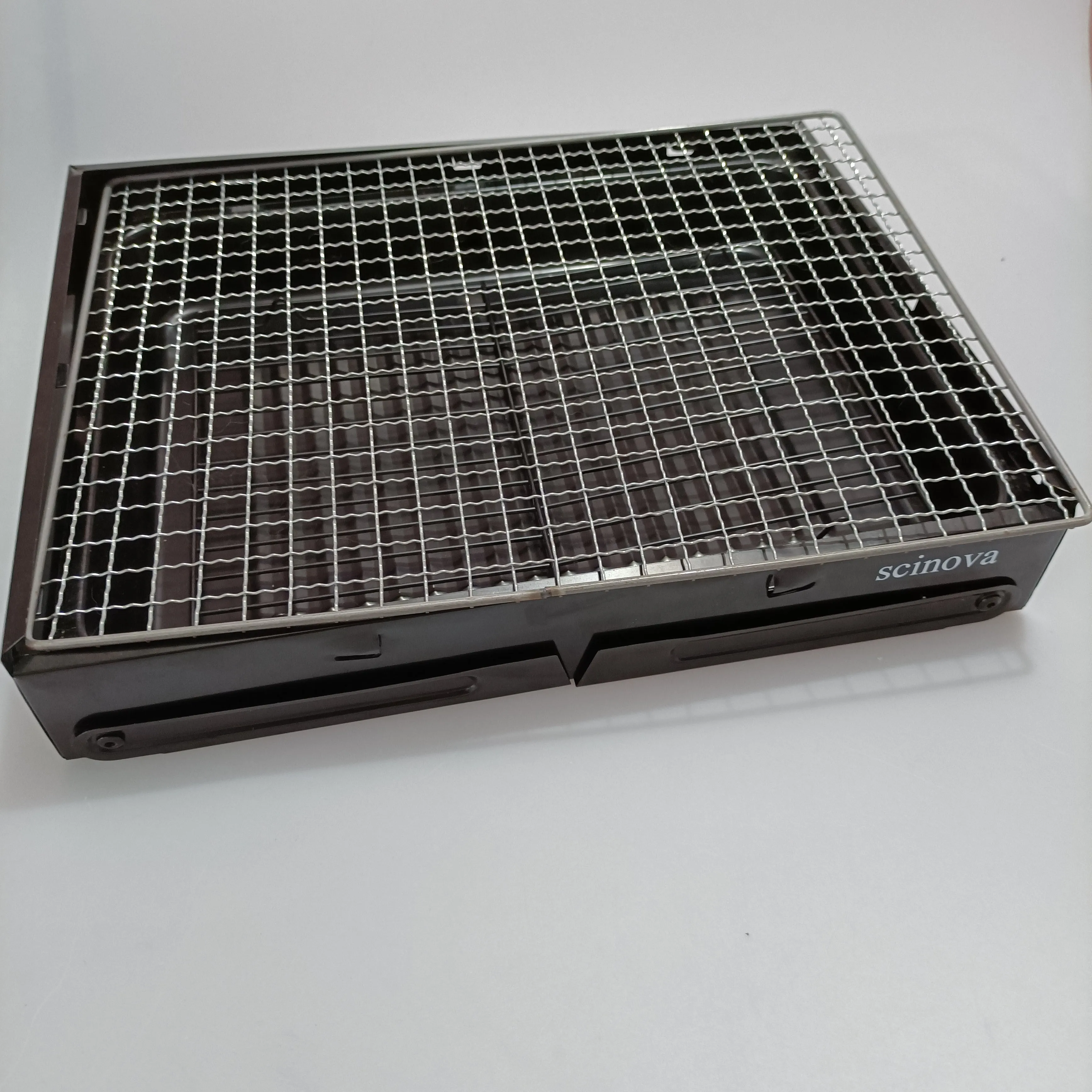 scinova Cooking utensils, namely, grills, foldable leg design, compact and portable