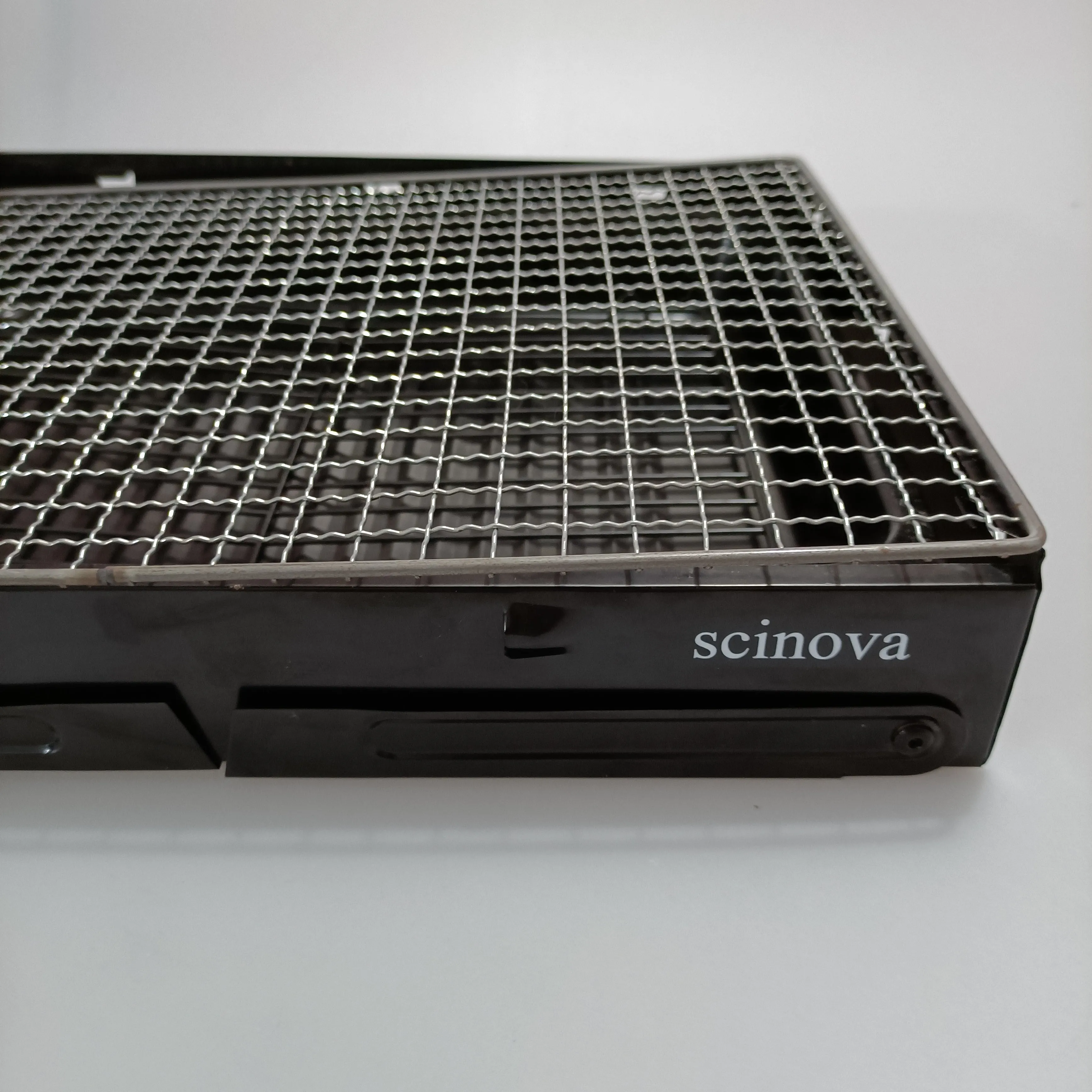 scinova Cooking utensils, namely, grills, foldable leg design, compact and portable